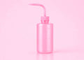 A translucent pink plastic watering can with a long curved nozzle, shown on a solid pink background.250ml or 500ml Pink/White Tattoo Wash Bottle Bratty Beauty XO