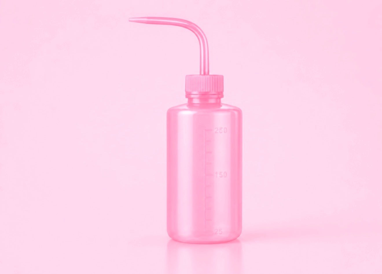 A translucent pink plastic watering can with a long curved nozzle, shown on a solid pink background.250ml or 500ml Pink/White Tattoo Wash Bottle Bratty Beauty XO