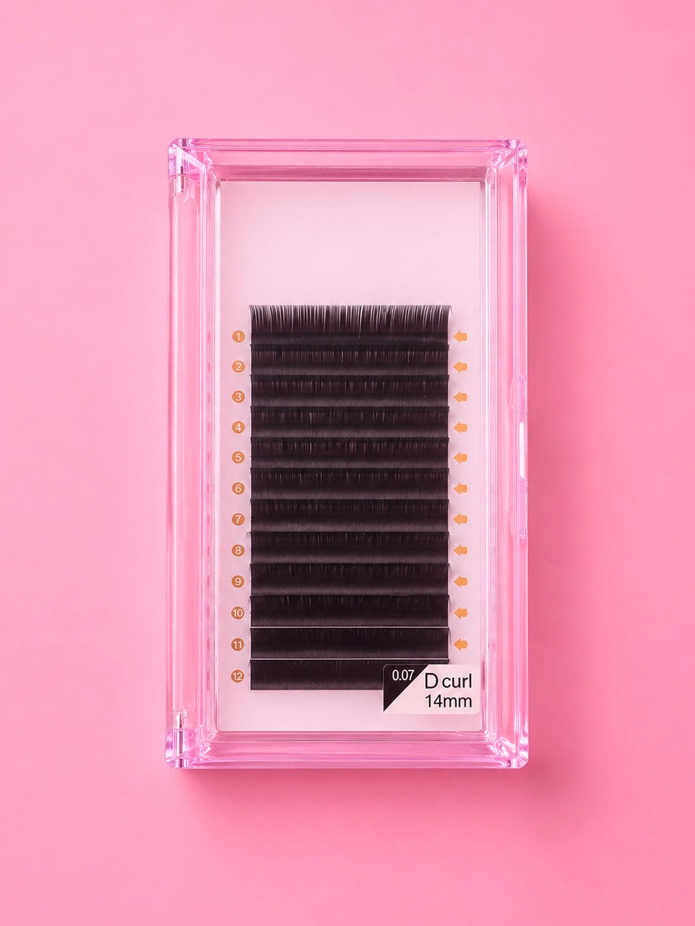 A pack of black false eyelash clusters in a clear pink plastic case, displayed on a solid pink background. Bratty Beauty XO Matte Black 0.07 D Curl 14mm Lash Extension Tray