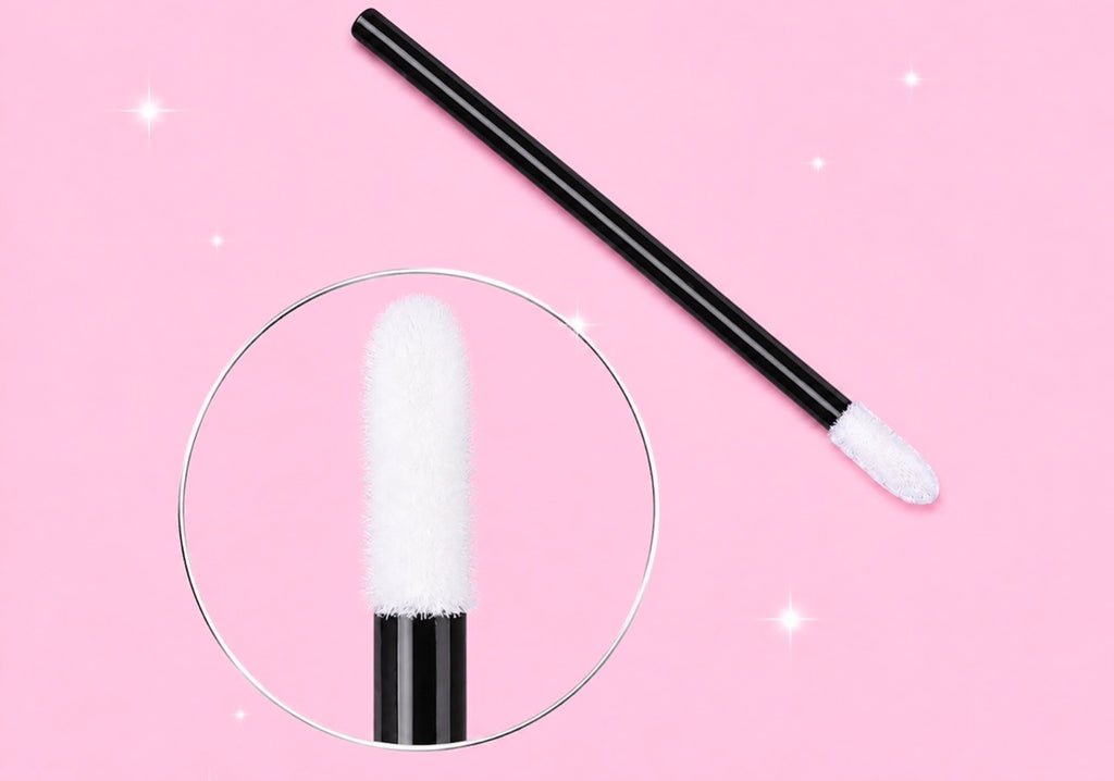 A black makeup sponge applicator with a white cotton tip, shown on a pink background with a circular zoom-in detail of the sponge head.Pink or Black Disposable Lip Brushes/ Lip Wands | 500 or 700 pcs